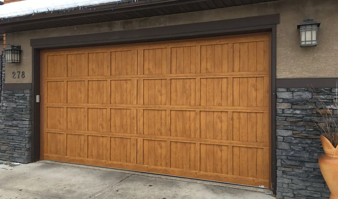 Insulated faux wood garage door
